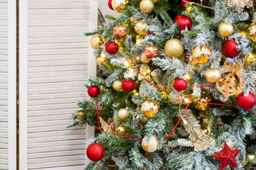 Beautifully decorated Christmas tree. New year is coming. Gold and red decoration.