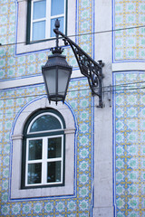 Fototapeta na wymiar Traditional lamp architecture in Lisbon city, Portugal, azulejos tile facade