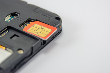 SIM card close-up next to the connector in the smartphone, phone