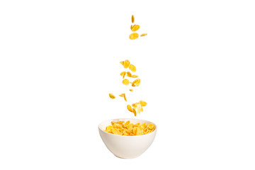 Corn flakes falling to the white bowl. Motion.