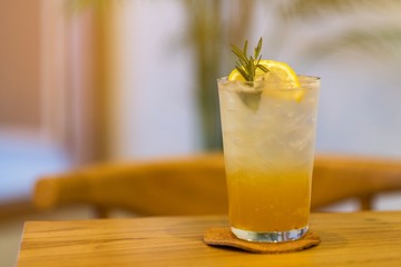 A glass of lemon soda in tropical cafe