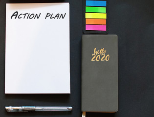 2020 new year goal, plan, action on notepad with office accessories. Business motivation. Inspiration concept.