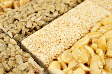 sugar glazed kozinak, sunflower seeds and peanuts in sugar glaze, Oriental sweets close-up macro, brittles