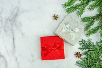 Christmas frame background on marbel with silver and red gift box