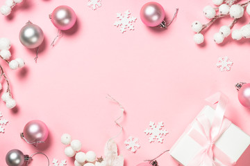 Fototapeta na wymiar Christmas present box and decorations on pink background.