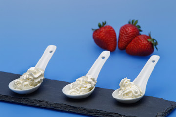 Whipped cream, with strawberries.