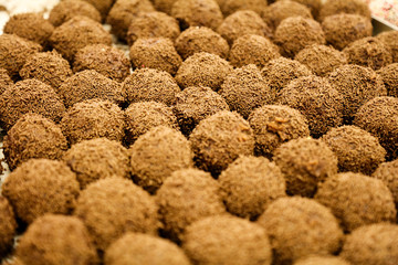 Round truffles with chocolate sprinkle in bakery