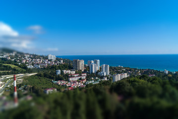 city houses in the metropolis on the ocean sea with the effect of miniatures, tilt shift, cityscape, view of the city top