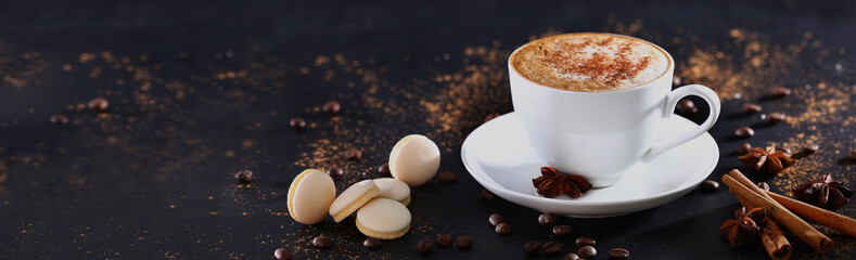 White cup with coffee on a gray background with cinnamon. View from above. Long banner. - obrazy, fototapety, plakaty