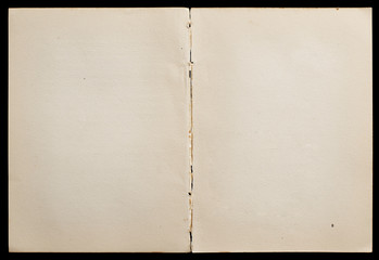 Antique book unfolded showing textured pages isolated on black background. - 307008832