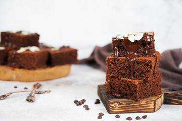 Delicious brownie chocolate cakes poured with warm chocolate and decorated with almond petals....