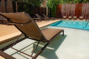 Outdoor Chaise Lounger next to the pool.