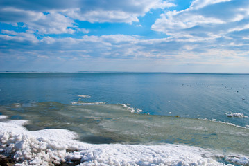 Blue water and ice on a clear sunny day