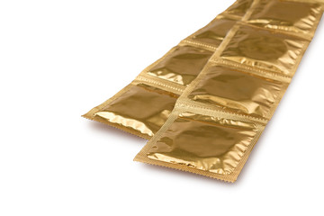 condoms in packaging isolated on a white background, the concept of contraception and prevention of...