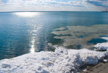 Blue water and ice on a clear sunny day