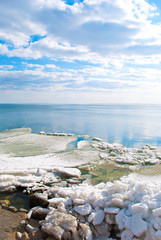 Blue water and ice on a clear sunny day