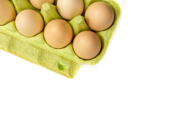 chicken eggs close-up isolated on white background in cardboard box for transportation