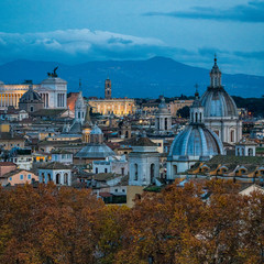 Rome skyline in the evening, as seen from Castel Sant'Angelo, with the dome of Saint Agnes Church...