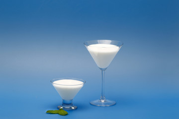 Tubs of natural yogurt, derived from cow's milk.