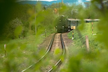 A steam passenger train arrives