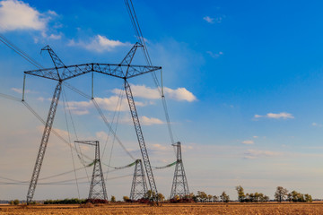 High voltage power line against blue sky