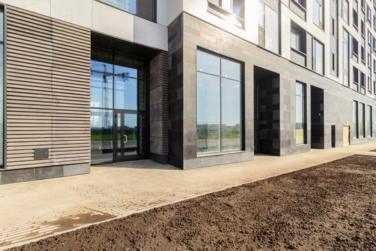 Panoramic window of modern residential building view outside. Insulating glass (glazing, pane). Storm windows. Ground floor apartment. first for shops, offices. commercial premises. Rainscreen. Door