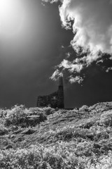 Naklejka na ściany i meble infrared black and white mine ruins on the cornish coast in cornwall uk 