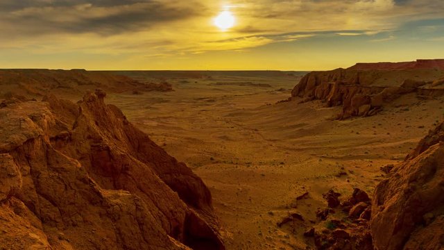 Bayanzag flaming cliffs at sunset in Mongolia, found in the Gobi Desert, timelapse 4k