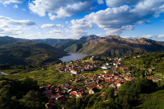 Aerial panoramic view of the historic village of Lindoso, with the surroundings mountains and lake, at the Peneda Geres National Park, in Portugal.