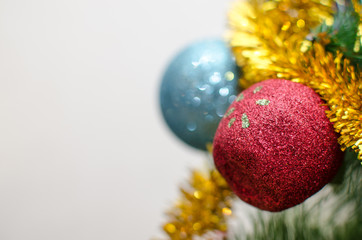 Christmas toys decorated with decorations and ribbons on a Christmas tree. New Year tree concept. Preparing for the winter holidays.