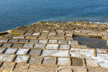 Salt panes in Malta carved in soft sandstone