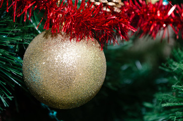 Christmas ball toy on a Christmas tree. New Year tree concept. Preparing for the winter holidays.