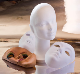 White mannequin head and masks