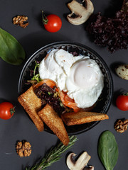 Culinary dishes made from natural products in a plastic bowl on the background with ingredients for cooking. Healthy food delivery concept. Top view.