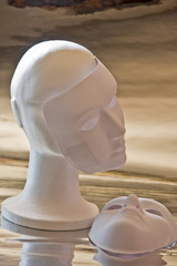 White mannequin head and masks