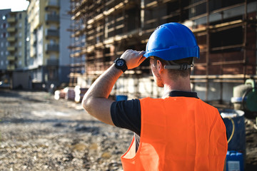 A man construction worker on building site.