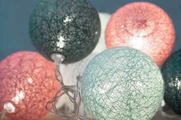 Christmas decorations. Winter holiday. New Year's garland. Festive illumination in the form of balls. Colorful balloons. Greeting card. Spheres of thread.
