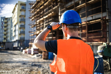 A man construction worker on building site.