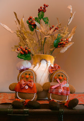 Christmas flowers decoration with Christmas puppets in warm vintage red colours