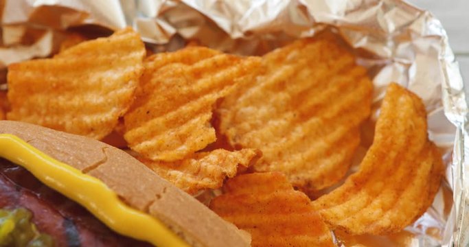 Video Slide Across Grilled Hot Dog With Chips