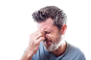 Man feels strong headache isolated. People, healthcare and medicine concept