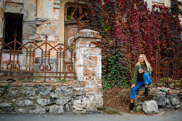 Obraz na płótnie Canvas Walk of a beautiful girl in a sweater and jeans