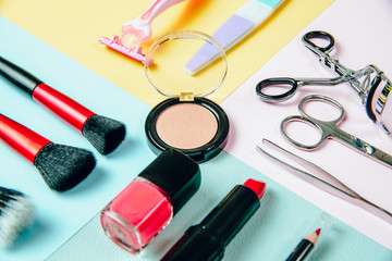 Top View on set of woman make up cosmetics on nice pastel background. Beauty and fashion concept....