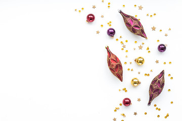 Red and gold christmas decorations on white background, flat lay, top view