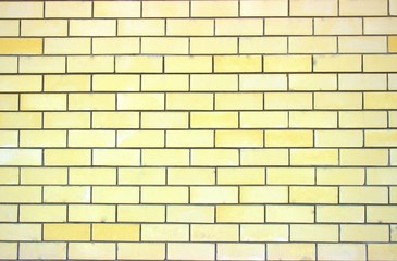Light yellow smooth brickwork of an apartment building built in our days. Good background for different screensavers