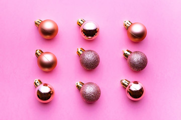 Christmas decoration balls isolated on pink background. Xmas pattern. Flat lay. Pattern winter bubble concept