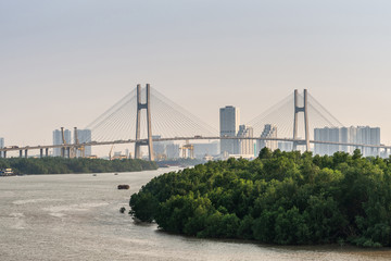 Green belt and Phu My bridge over Song Sai Gon river, Ho Chi Minh City, Vietnam.