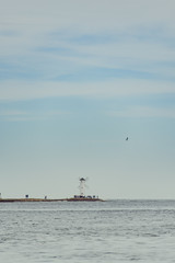 Old lighthouse in Swinoujscie, a port in Poland on the Baltic Sea. The lighthouse was designed as a traditional windmill. Panoramic image.