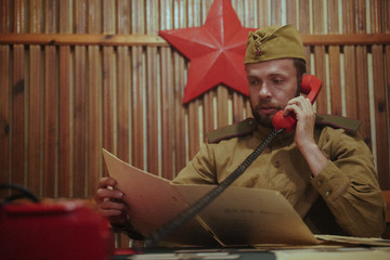 Soviet times military Soldier with Phone in the headquarters bunker