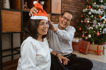 big family put santa hat during christmas gathering together